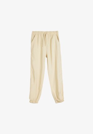 Beige Jogginghosen mit einem Kordelzugbund, elastischen Bündchen und Seitentaschen. Aus einem weichen, leichten Stoff gefertigt.