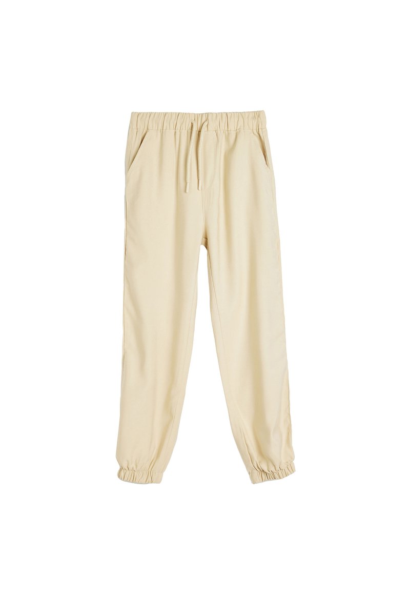 Beige joggerbukser med snoretræk i taljen, elastiske manchetter og sidelommer. Fremstillet af et blødt, letvægtsstof.