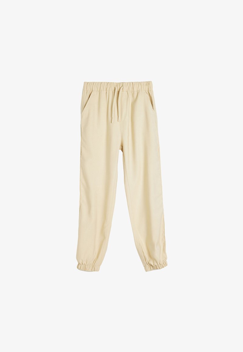Pantalones jogger beige con cintura ajustable, puños elásticos y bolsillos laterales. Confeccionados en una tela suave y ligera.