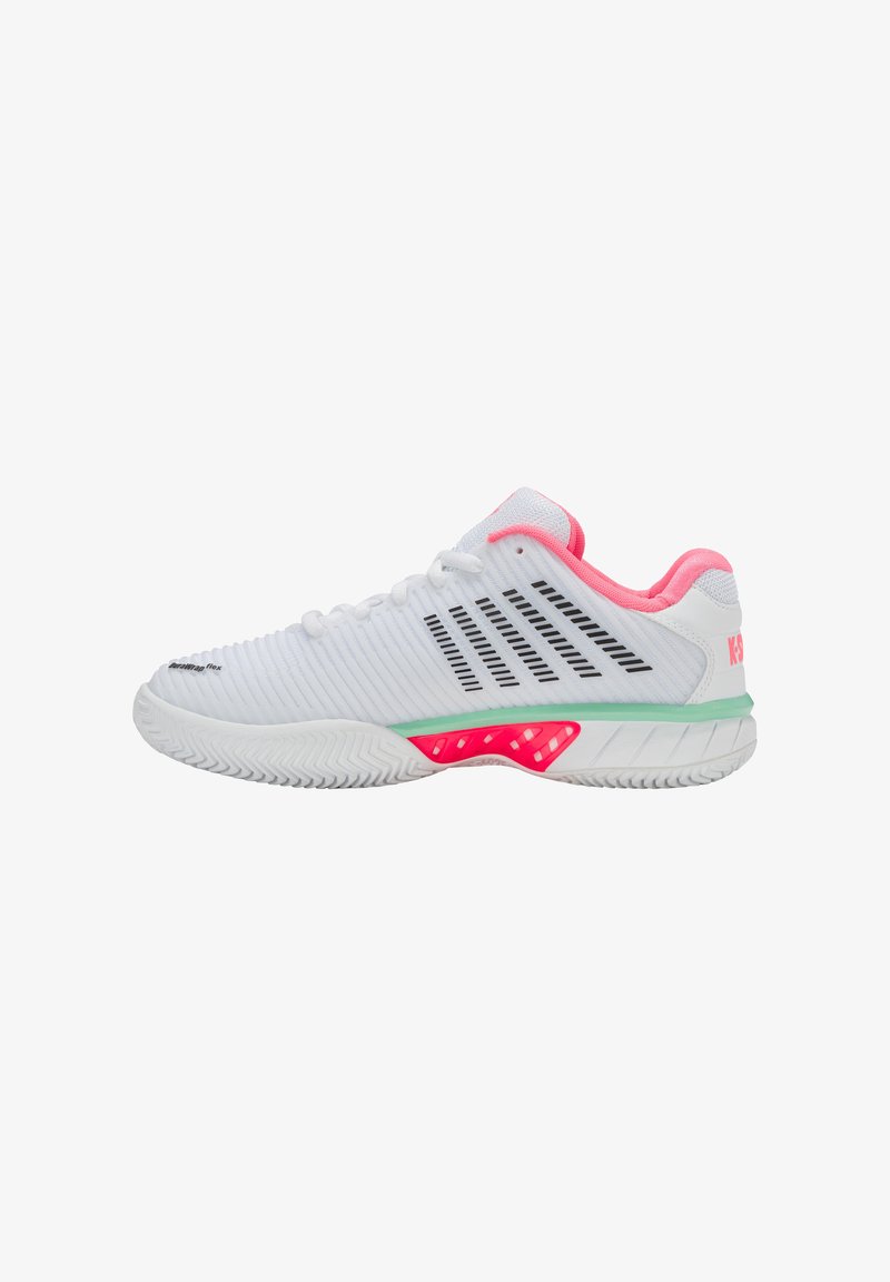 White athletic shoes with striped texture, pink accents, and a green midsole. Features a textured rubber sole for traction.