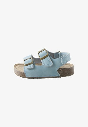Light blue child’s sandal with two adjustable buckle straps and a back strap over a cork sole and rubber outsole.
