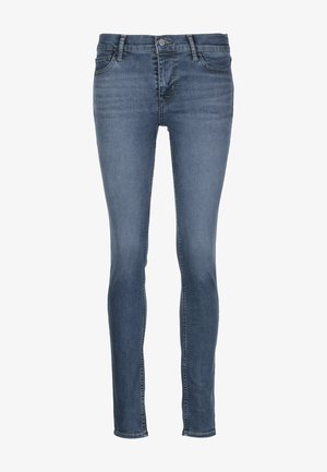 Modré džíny skinny s mírným pasem, pěti kapsami a jemným zesvětlením. Obsahují zip a kovové zapínání na knoflík.