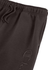 Donkergrijze sweatpants van zachte stof met een elastische tailleband, verstelbaar trekkoord en een subtiele borduursel met logo.
