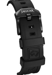 Schwarzes Gummi-Uhrenarmband mit graviertem Jaguar-Logo auf einer metallenen Schnalle, ausgestattet mit mehreren Verstelllöchern und einer strukturierten Oberfläche.