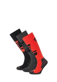 Three pairs of socks: one black with red accents, a darker gray pair, and a red sock with black patterns and logo. All mid-calf length.
