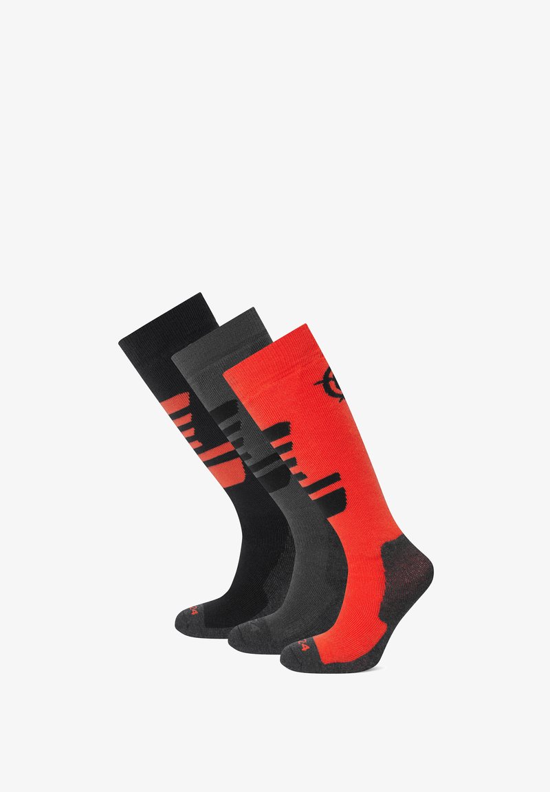 Three pairs of socks: one black with red accents, a darker gray pair, and a red sock with black patterns and logo. All mid-calf length.