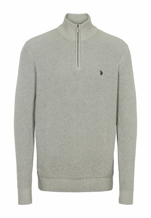 Hele hall, soonikko, millel on kõrge krae ja poolt tõmbetõmme. Sisaldab väikest sümbolit rinna peal ning soonikkoed ja alläär.