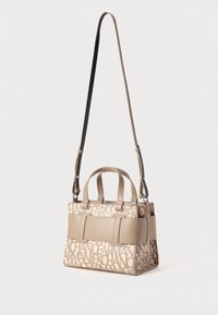Beige handbag with logo print, structured design, dual top handles, removable shoulder strap, and a smooth texture with accent details.