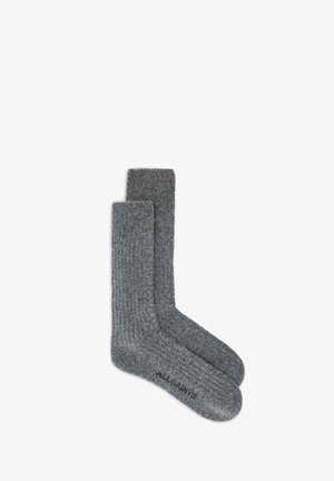 Grau gestreifte Socken aus einem weichen Material mit einer leichten Textur. Verfügt über ein Logo an der Basis und ein klassisches Crew-Längen-Design.