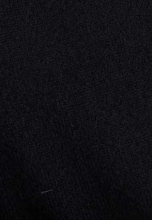 Tissu noir texturé avec une surface douce et légèrement fluffy, présentant une couleur uniforme sans motifs ni matériels visibles.