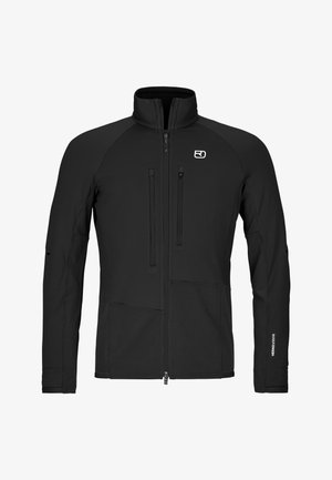 Schwarze Langarmjacke mit Reißverschluss und hohem Kragen, zwei vertikalen Brusttaschen mit Reißverschlüssen und Logo auf der linken Brustseite.