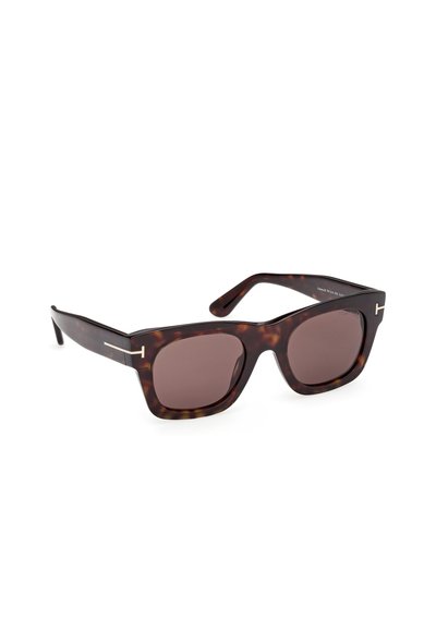 Bruna sköldpaddsmönstrade solglasögon med fyrkantig form, bruna linser och minimala metallaccenter på bågarna. Strukturerad yta med blank finish.