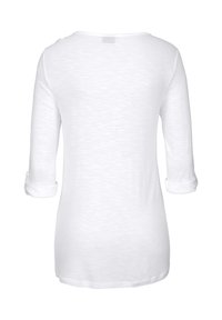 White, long-sleeve top with a rolled cuff design, featuring a smooth texture and lightweight fabric, displayed from the back.