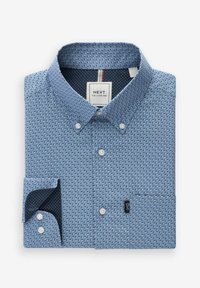 Camicia tessuta azzurro chiaro con motivo testurizzato, colletto button-down e un taschino sul petto. Fodera interna navy a contrasto con pois.