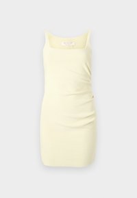 Rumenčka brez rokavov v rumeni barvi, izdelana iz gladkega materiala, z kvadratnim izrezom in zbranim stranskim detajlom za dodaten tekstur.