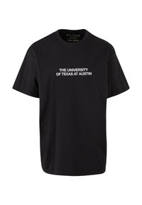 Juodas medvilnės marškinėlis su ryškiu baltu tekstu, kuris sako "Teksaso universitetas Ostine" per krūtinę. Trumpomis rankovėmis, laisvas pjūvis.