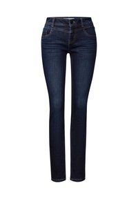 Mörkblå jeans i denim, med slim fit, femfickorsdesign och kontrasterande gul tråd längs sömmarna och fickorna.