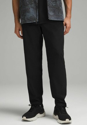 FAST AND FREE WATERPROOF RAIN - Tepláky - black