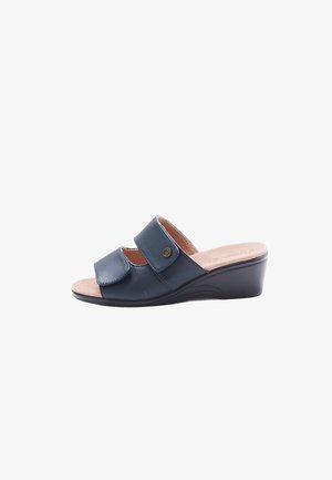 Sandale compensée pour femme en cuir bleu marine avec deux brides ajustables et une semelle intérieure beige rembourrée.