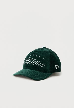 Green velvet cap with a curved brim, featuring embroidered "Oakland Athletics" text in white. Includes a small logo on the side.