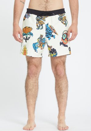 Shorts de bain avec un fond blanc présentant des impressions colorées et détaillées de personnes, d'animaux et de formes. Ceinture élastique avec cordon de serrage.