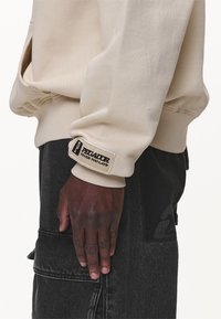 Pegador Sweat à capuche - sand