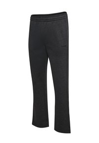 Zwarte sportieve broeken van een zacht, gestructureerd materiaal met een relaxte pasvorm en een elastische tailleband, met een klein logo aan de zijkant.