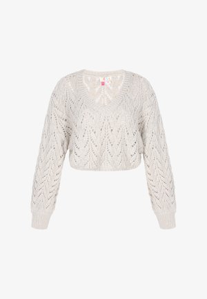 Lyhennetty, vaaleanbeige neulepaita, jossa on syvä V-pääntie ja hieno pitsikuvio. Pitkät hihat ribbausmalla.