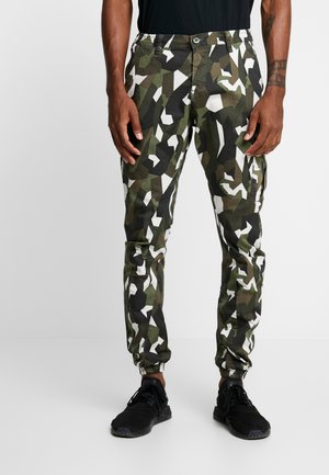 Urban Classics GEOMETRIC CAMO STRETCH PANTS - Bojówki - wood