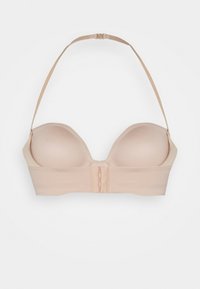 Beige voorgevormde bh met verstelbare bandjes, naadloos design en haaksluiting. Glad materiaal en zachte textuur.