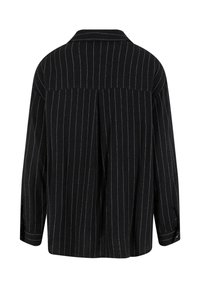 Black and white pinstriped shirt with a collar, long sleeves, and back pleat detail. Made of fabric with a smooth texture.