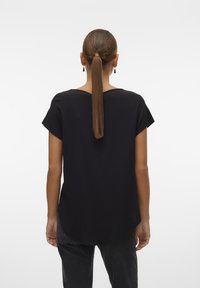 Black short-sleeve top with a curved hemline, made from smooth fabric. Simple design with no visible patterns or hardware details.