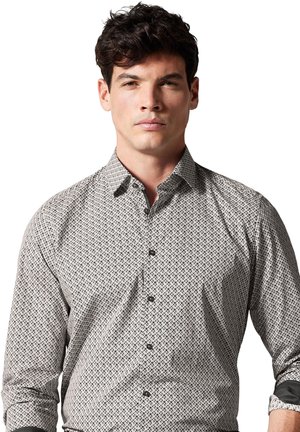 Patroon overhemd met lange mouwen, zwart-wit geometrisch ontwerp, knoopsluiting, knopen die bij de stof passen, gestructureerd katoenmateriaal.