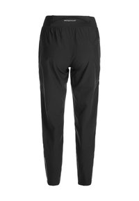 Svarta träningsbyxor med en slät textur, elastisk midja och avsmalnande ben. Har en logotyp nära midjan och sidofickor.