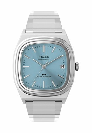Montre-bracelet automatique Timex avec bracelet en métal argenté, cadran bleu clair, index des heures en argent, trois aiguilles et affichage de la date réglé au 14.