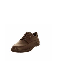 Chaussure habillée en cuir brun avec un bout rond, un design à lacets et une semelle en caoutchouc texturée. Présente une couture discrète et un logo de marque sur le côté.