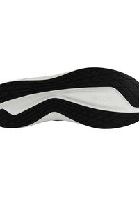 Semelle de chaussure incurvée en noir et blanc avec motif de grip texturé et logo embossé "ecco" au centre.