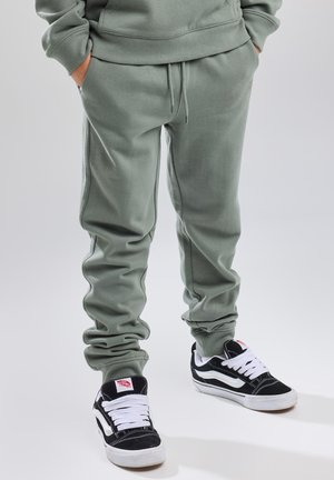 America Today, JOGGING COLE JR - Tracksuit bottoms - cascade