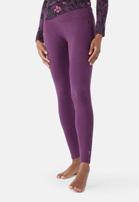 Leggings viola realizzati in materiale elastico, caratterizzati da una superficie liscia e una vestibilità aderente. Piccolo accento notevole vicino alla caviglia.