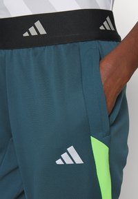 adidas Performance TIRO 23 COMPETITION - Trainingsbroek - arctic night/semi lucid lime