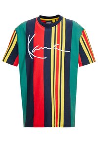 Flerfärgad bomulls-t-shirt med vertikala ränder i röd, grön, gul och marinblå med vit signaturdetalj på framsidan, oversized passform.