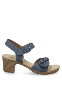 Sininen nahkasandaali, jossa on rusettiyksityiskohta, solkikiinnitys, korkkimidsole ja 5 cm paksupohja. Avoin kärki ja luonnollinen tekstuuri.