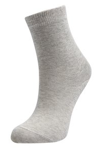 Calzino grigio alla caviglia realizzato in materiale liscio, con bordino a coste e una trama semitrasparente, punta arrotondata e design minimal.