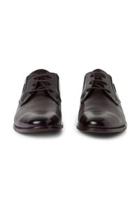 Chaussures de ville en cuir marron avec une finition brillante, dotées de bouts ronds, de lacets classiques et d'une texture lisse.