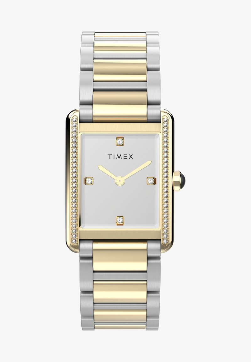 Roestvrijstalen en goudkleurige rechthoekige horloge met een witte wijzerplaat, vier diamanten-achtige markeringen en een decoratieve edelstenen bezel.