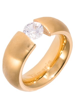 Guldring med en bred skive, der er delt foroven, og holder en rund, klar ædelsten, der hænger mellem åbningen.