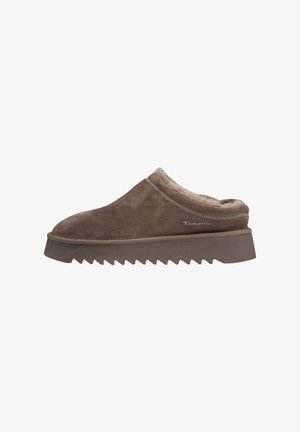 Brown suede clogs with a fluffy interior, featuring a wedge sole with a zigzag pattern and subtle logo detail on the side.