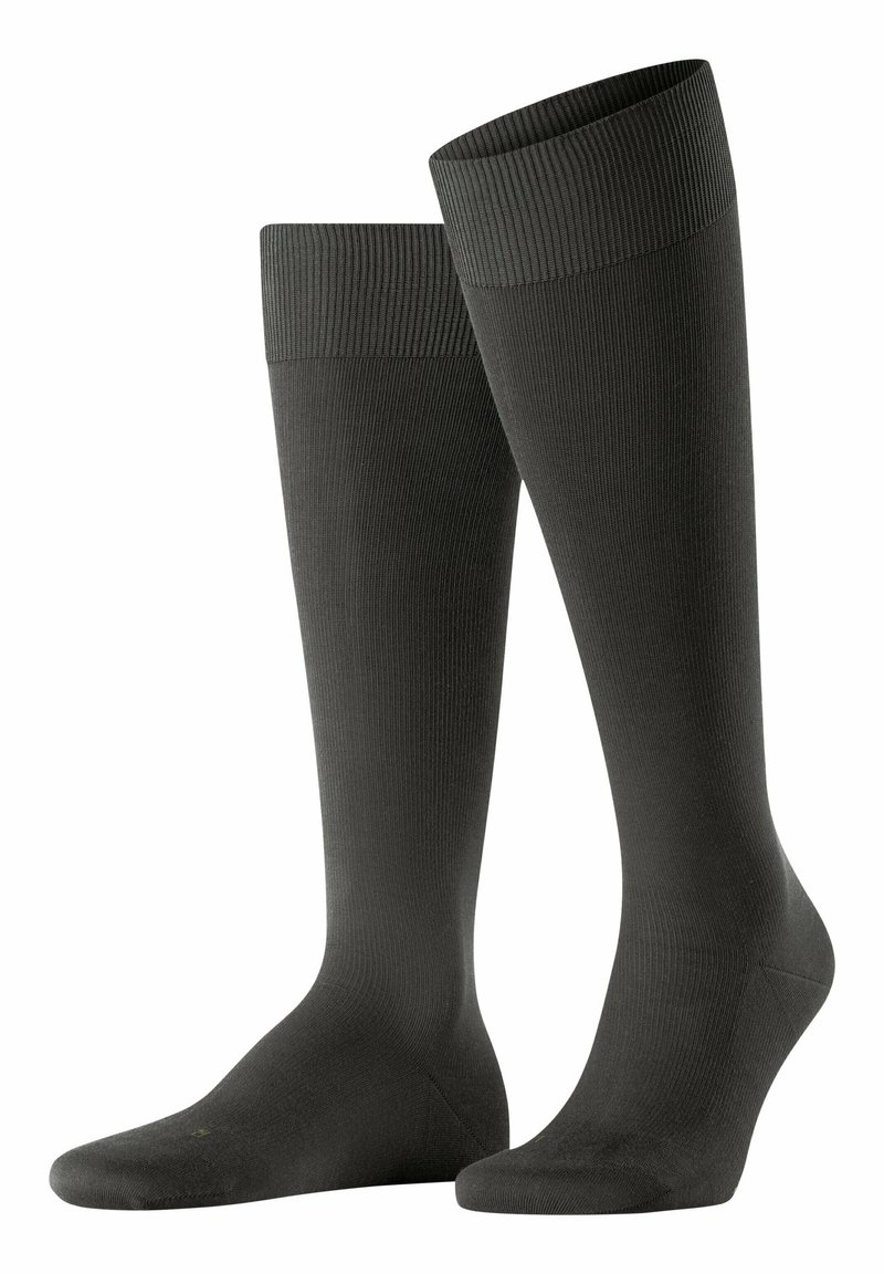 Knielange schwarze Socken mit gerippter Textur, elastischem Bündchen und glattem Oberteil, entworfen für Komfort und Unterstützung.
