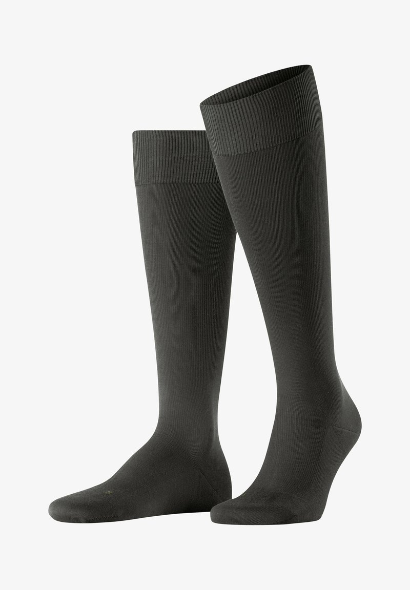 Knielange schwarze Socken mit gerippter Textur, elastischem Bündchen und glattem Oberteil, entworfen für Komfort und Unterstützung.