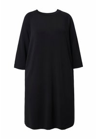 Robe noire oversize avec manches raglan trois-quarts. Confectionnée dans un tissu doux et lisse, avec un col rond classique et une coupe décontractée.